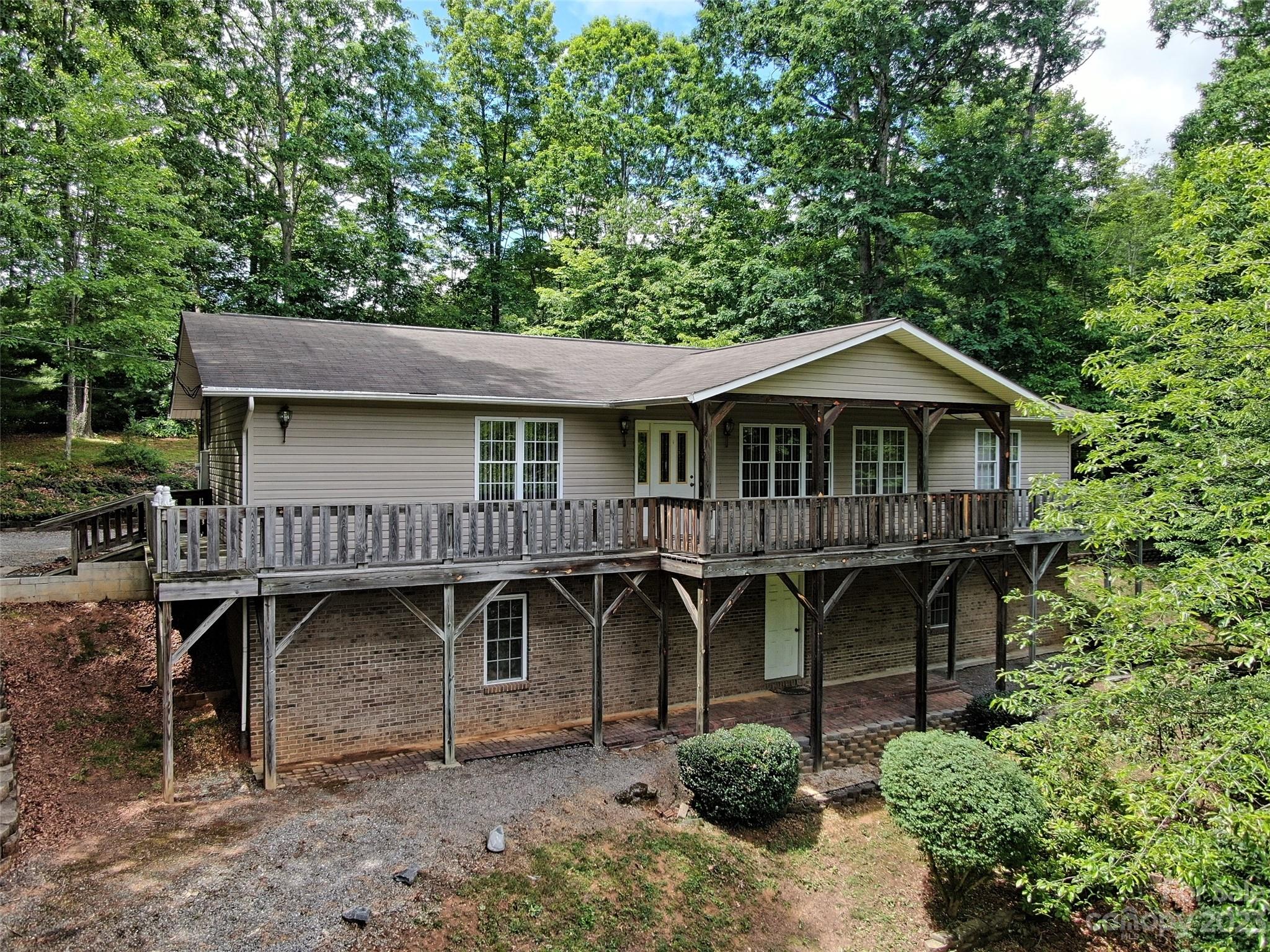 799 Nellie John Drive Clyde, NC 28721 - Photo 5 of 38 a front view of a house with balcony