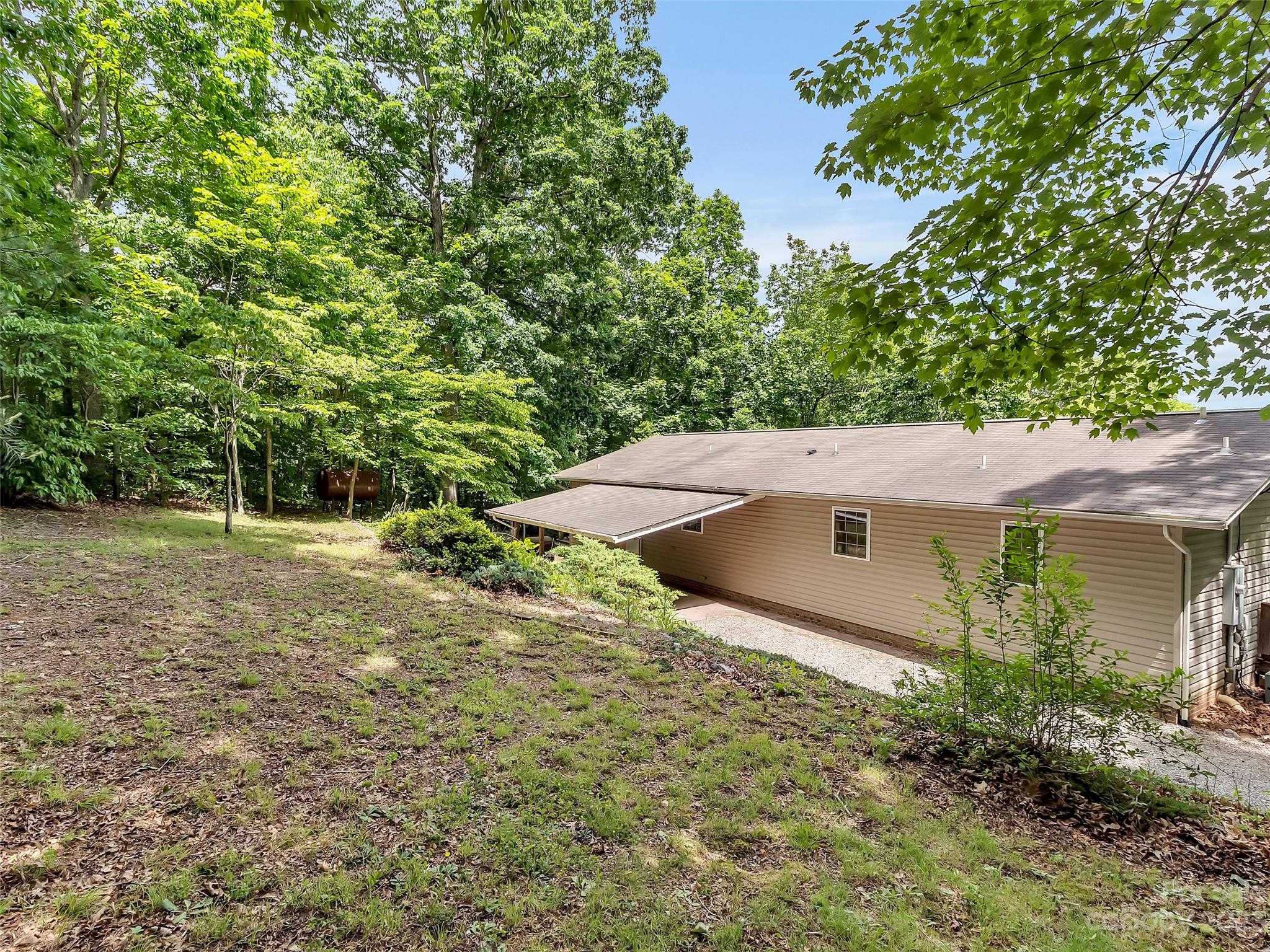 799 Nellie John Drive Clyde, NC 28721 - Photo 6 of 38 an aerial view of a house with a yard