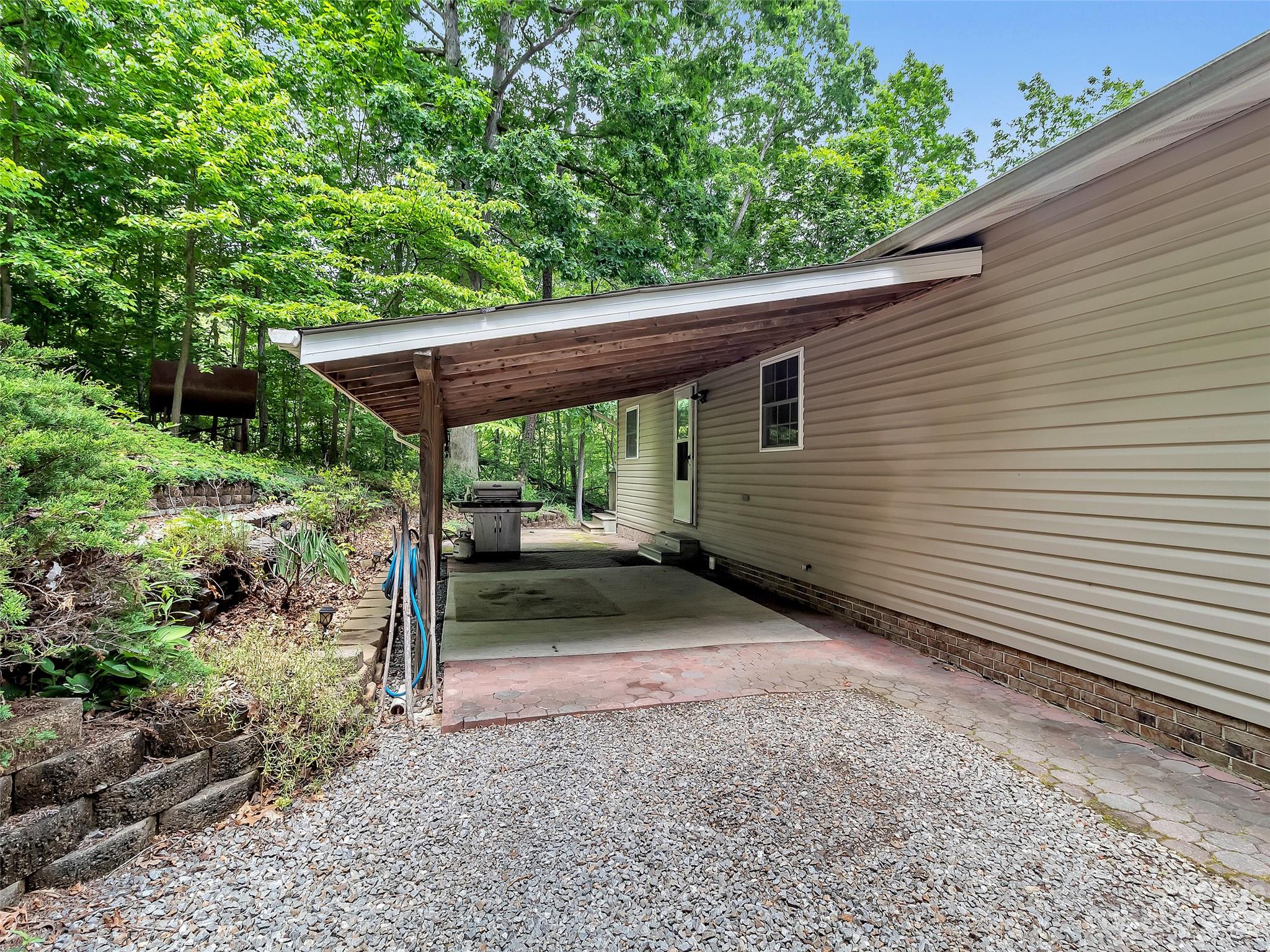799 Nellie John Drive Clyde, NC 28721 - Photo 8 of 38 a house view with a backyard space