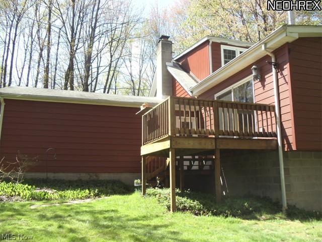 6533 Taylor Road Painesville, OH 44077 - Photo 4 of 25 SIDE VIEW WITH A DECK THAT LEADS FROM THE LARGE 1ST FLOOR FAMILY ROOM.