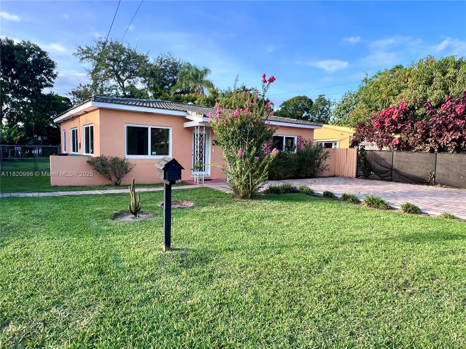 6225 Southwest 26th Street Miami, FL 33175 - Photo 2 of 10 a house view with a garden space