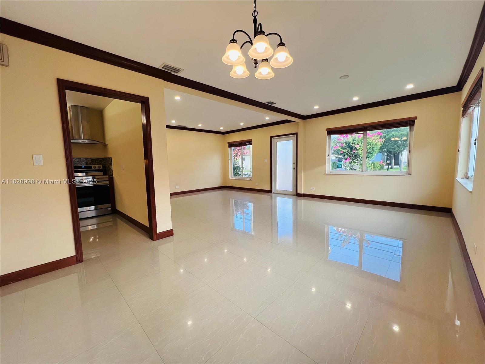6225 Southwest 26th Street Miami, FL 33175 - Photo 3 of 10 a view of a livingroom with a ceiling fan