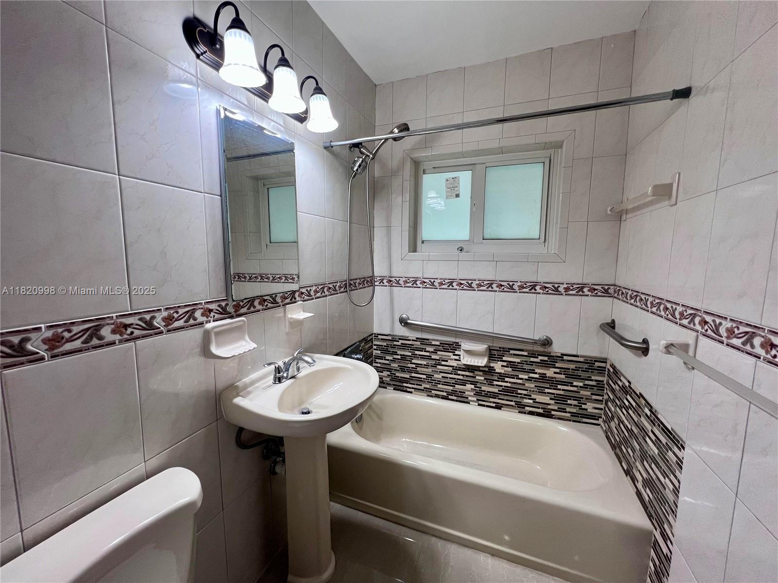 6225 Southwest 26th Street Miami, FL 33175 - Photo 6 of 10 a bathroom with a sink and a mirror