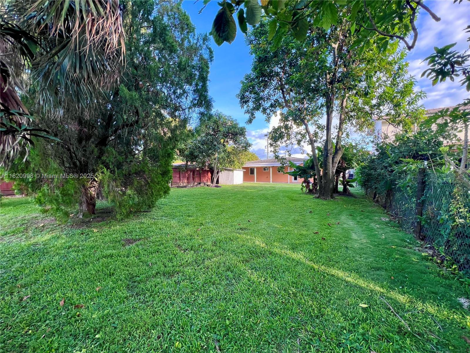 6225 Southwest 26th Street Miami, FL 33175 - Photo 10 of 10 a view of house with backyard space and garden