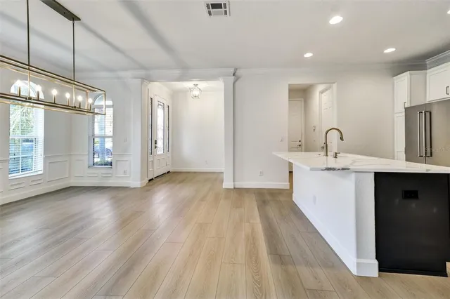 a kitchen with sink and cabinets