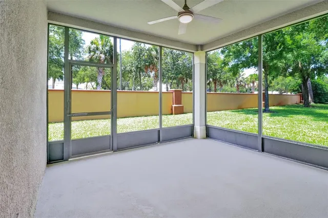 an empty room with large windows