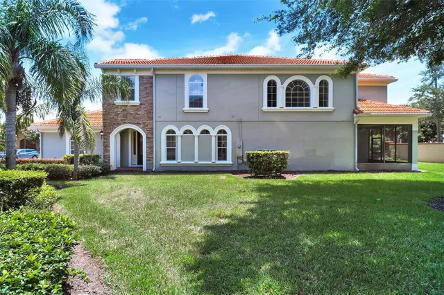 a front view of house with yard and green space