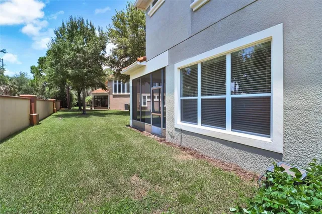 a view of a backyard with a garden and trees