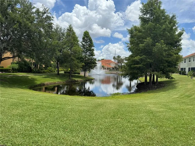 a view of a lake with a house in the background