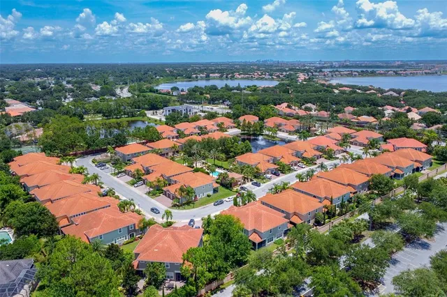 an aerial view of residential houses with outdoor space