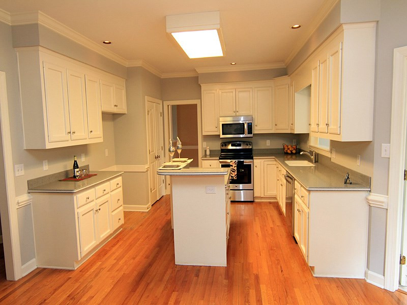 7023 Spring Ridge Road Cary, NC 27518 - Photo 4 of 12 Plenty of cabinets, a large pantry and desk area make up this clean and functional kitchen. New appliances! Kitchen