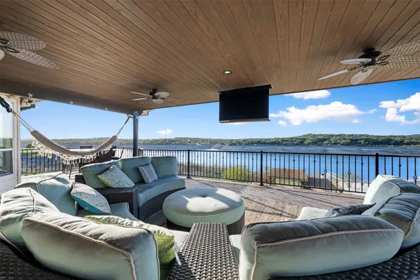 a view of a balcony with wooden floor and city view
