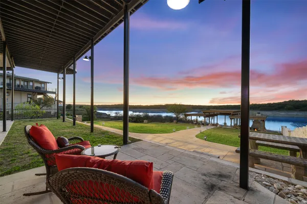 a view of a backyard with sitting area