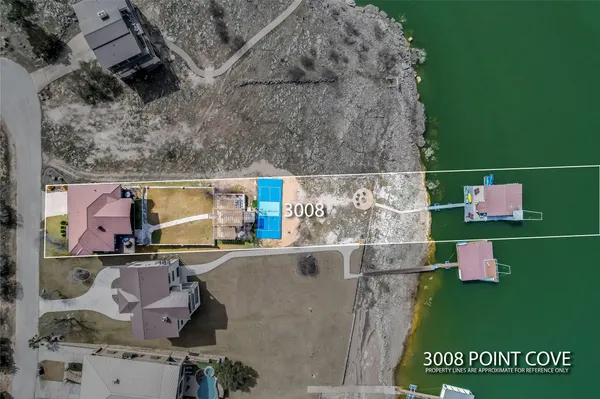 an aerial view of residential house with outdoor space and parking
