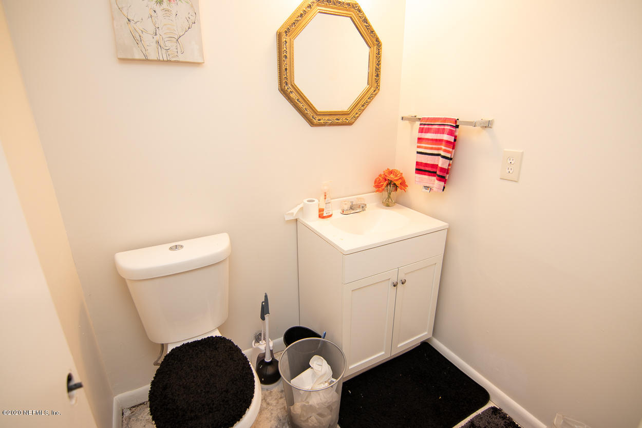 1701 Rogero Road Jacksonville, FL 32211 - Photo 14 of 20 a bathroom with a sink and a vanity