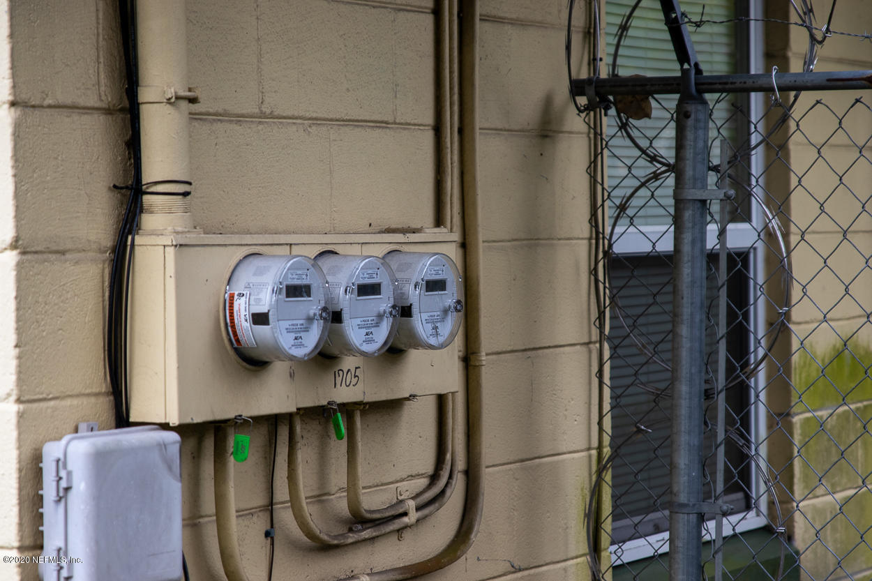1701 Rogero Road Jacksonville, FL 32211 - Photo 5 of 20 a kitchen with stainless steel appliances granite countertop a refrigerator and a stove top oven