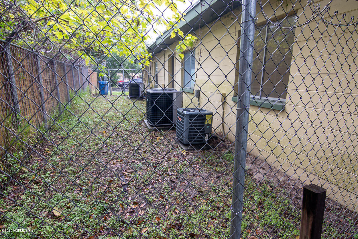 1701 Rogero Road Jacksonville, FL 32211 - Photo 6 of 20 a backyard of a house with table and chairs