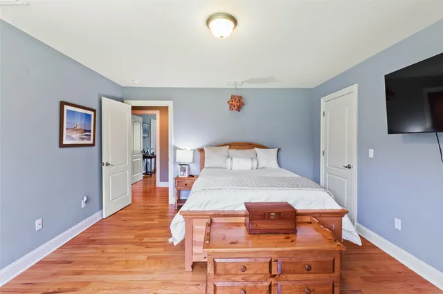 a bedroom with bed and tv