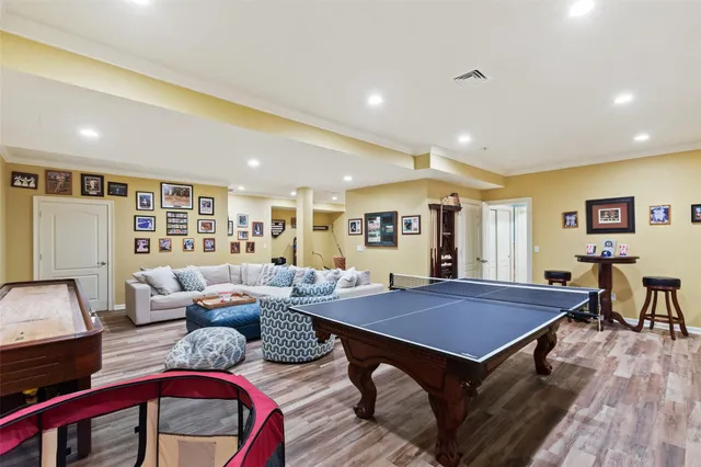 a living room with furniture a rug and a table