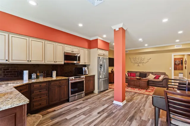 an aerial view of a house with outdoor space pool seating area and yard