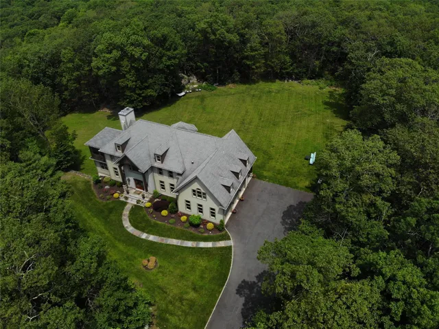 an aerial view of a house with mountain view