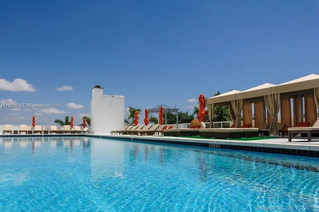 a view of a tree in front of a yard