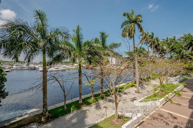 a living room with furniture and flowers
