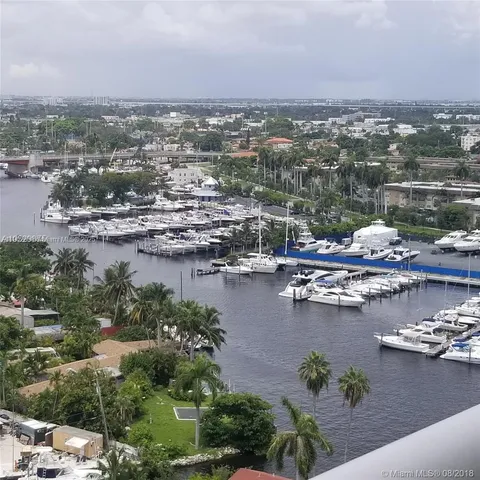 a view of a swimming pool with outdoor seating