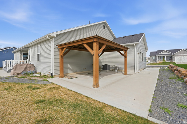 638 Canyon Rim Road Smithfield, UT 84335 - Photo 48 of 56 View of side of property with a gazebo, a patio area, and RV space