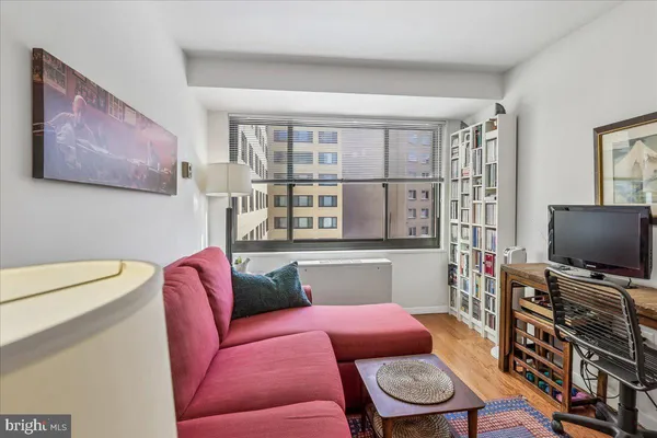 a living room with furniture and a window