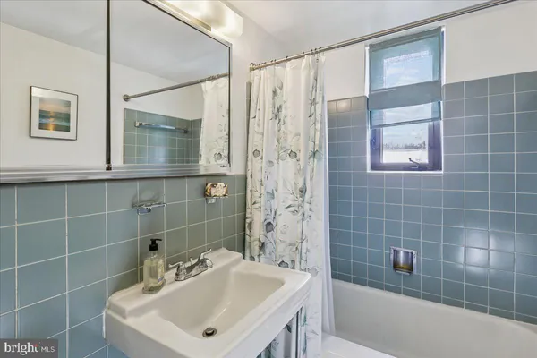 a kitchen with stainless steel appliances granite countertop a sink a refrigerator and a stove