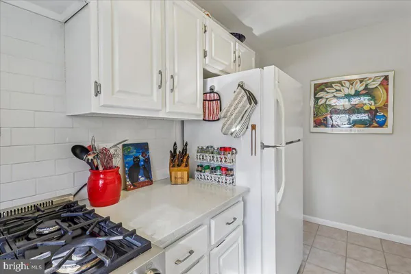 a kitchen with stainless steel appliances a stove and a refrigerator