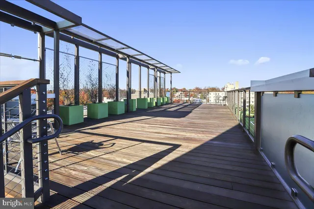 a living room with furniture and view of kitchen