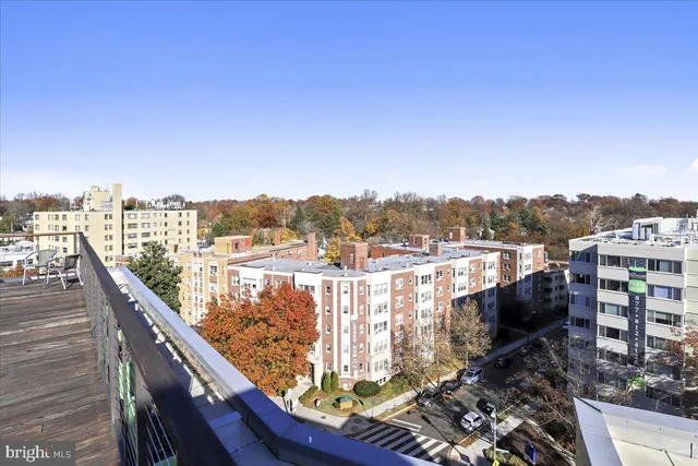 a kitchen with stainless steel appliances granite countertop a refrigerator and a stove