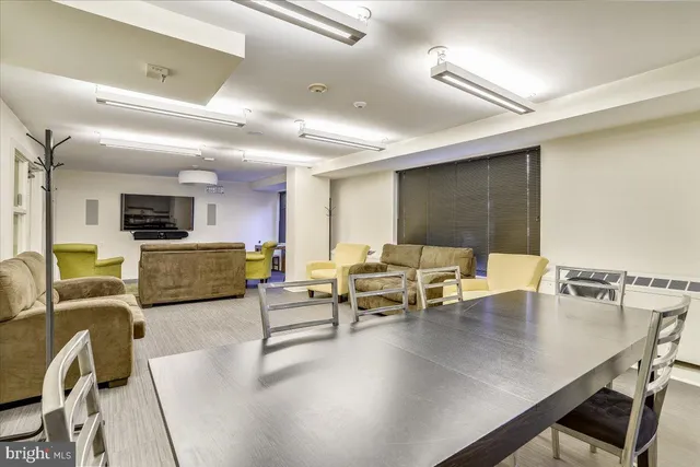 a view of a building with snow on the road