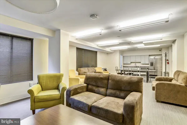 a street sign on a sidewalk next to a road