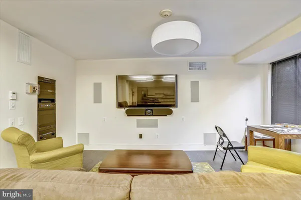 a view of a tall building next to a road