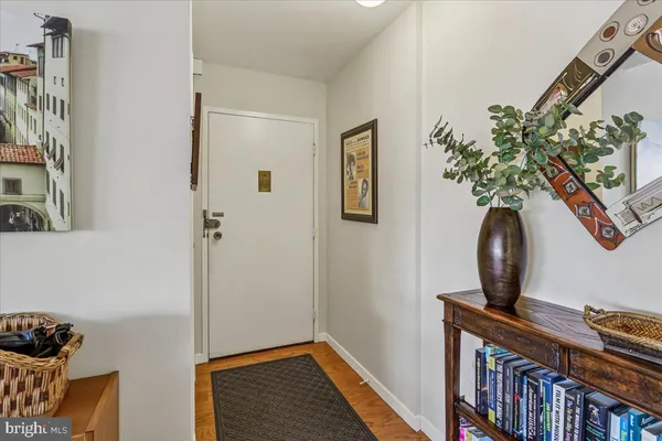 a living room with furniture a rug and a large window