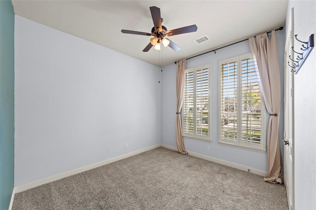 7929 Maddox Road Plano, TX 75024 - Photo 11 of 26 1st floor spacious bedroom with shutters and ceiling fan. Full bath, another sleep space or office and laundry on 1st level.