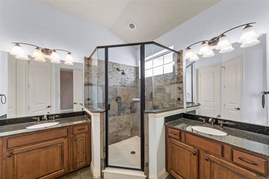 7929 Maddox Road Plano, TX 75024 - Photo 9 of 26 Bathroom with a stall shower and two vanities