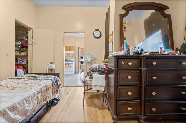 a bedroom with a bed and a closet