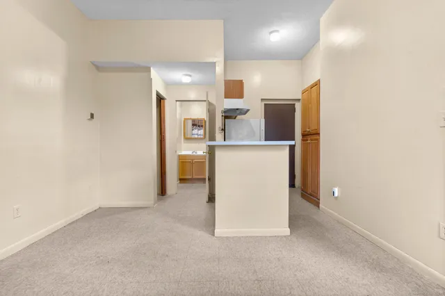 a view of a kitchen with a sink and dishwasher