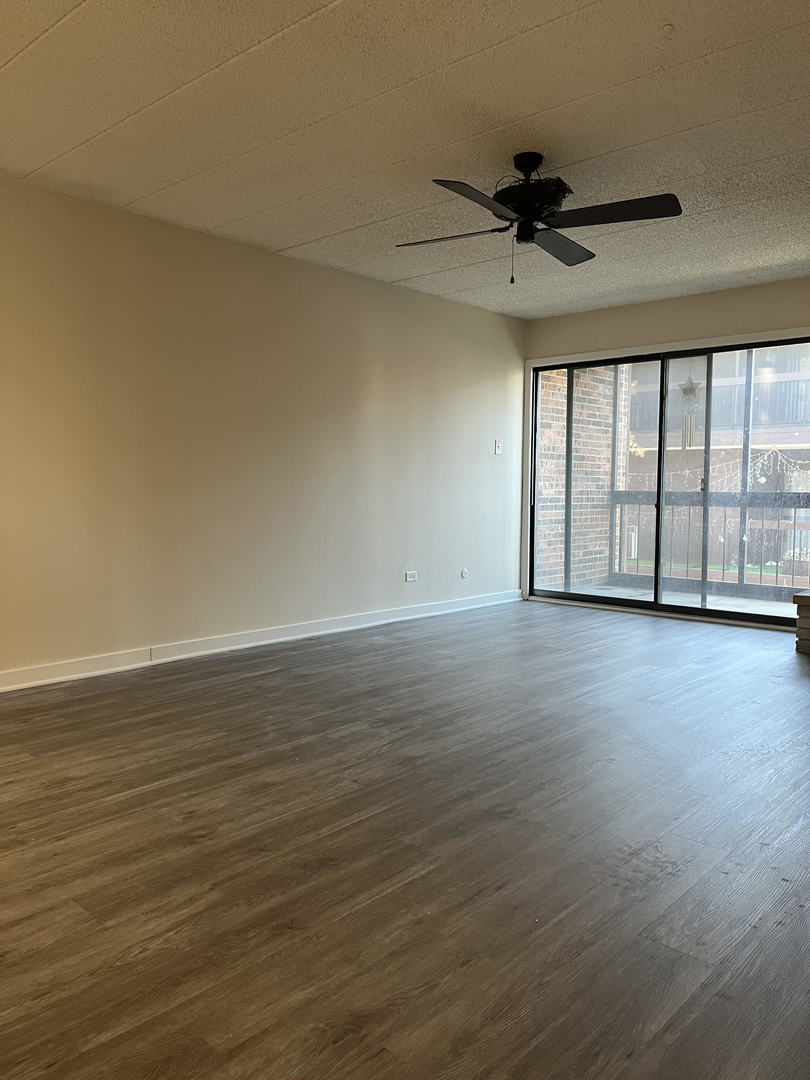 5515 Cromwell Lane, Unit M2 Oak Forest, IL 60452 - Photo 12 of 25 a view of an empty room with a window