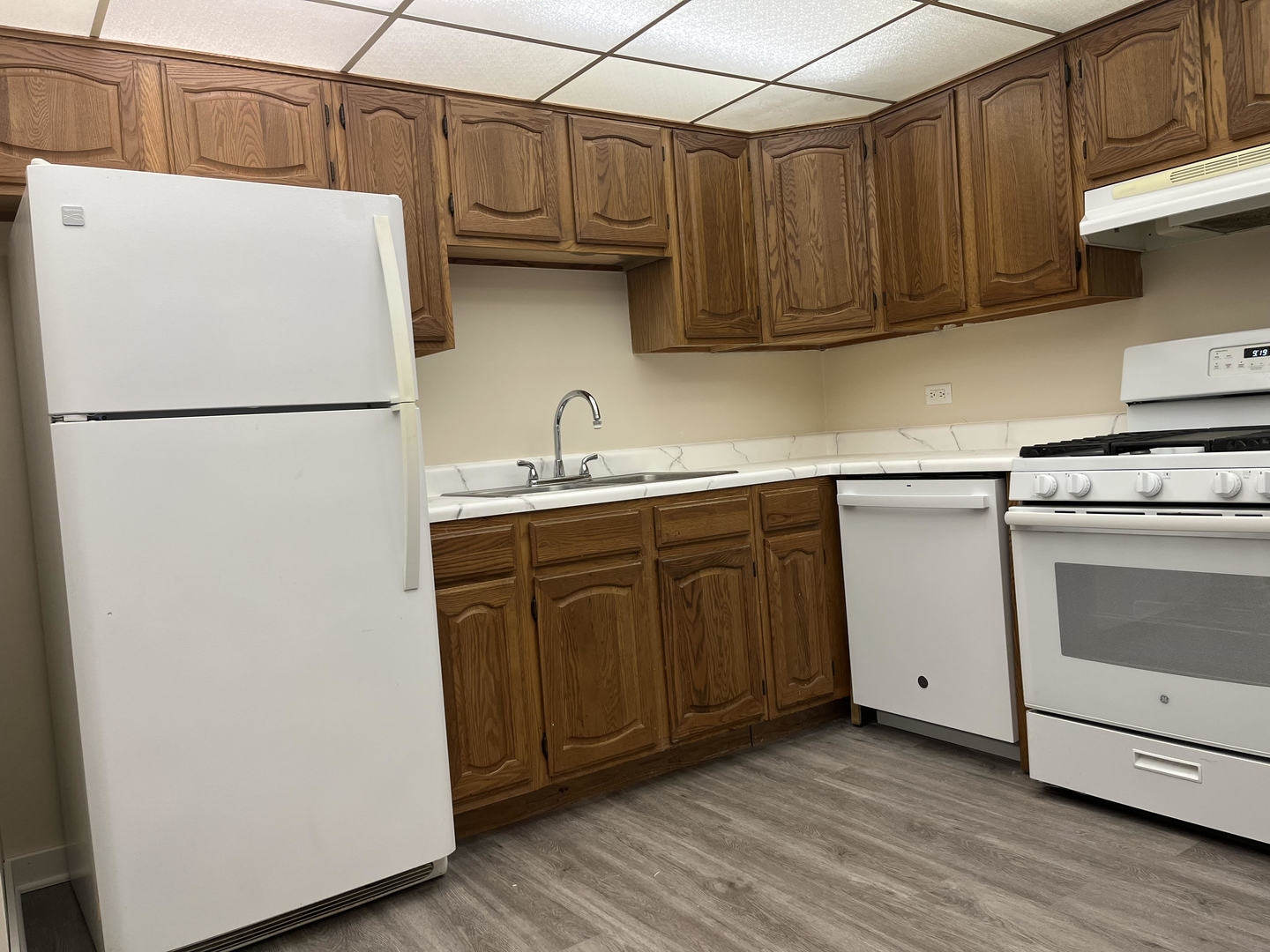 5515 Cromwell Lane, Unit M2 Oak Forest, IL 60452 - Photo 14 of 25 a white refrigerator freezer sitting inside of a kitchen