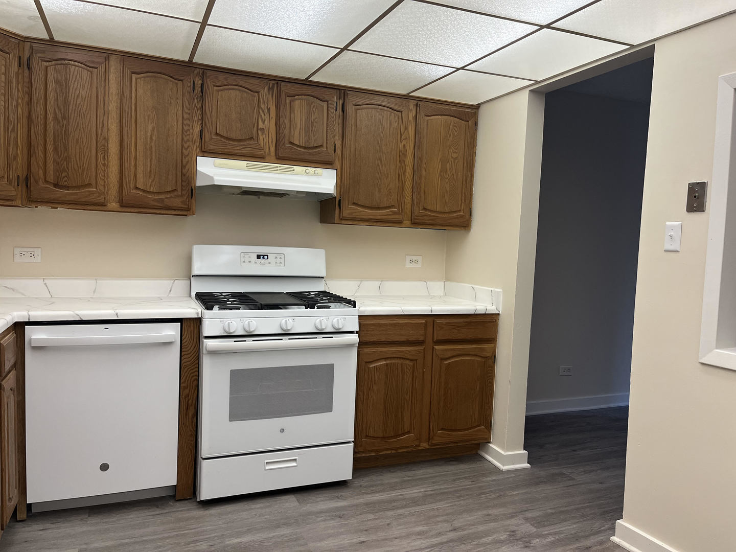 5515 Cromwell Lane, Unit M2 Oak Forest, IL 60452 - Photo 15 of 25 a kitchen with stainless steel appliances granite countertop a stove a microwave and cabinets
