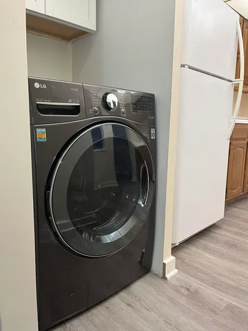 a view of wooden floor in a small room