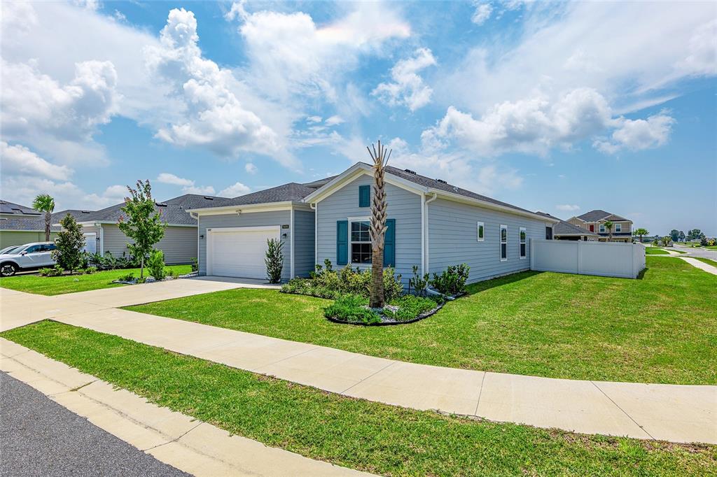 5688 Southwest 92nd Place Ocala, FL 34476 - Photo 2 of 54 a front view of house with yard and green space