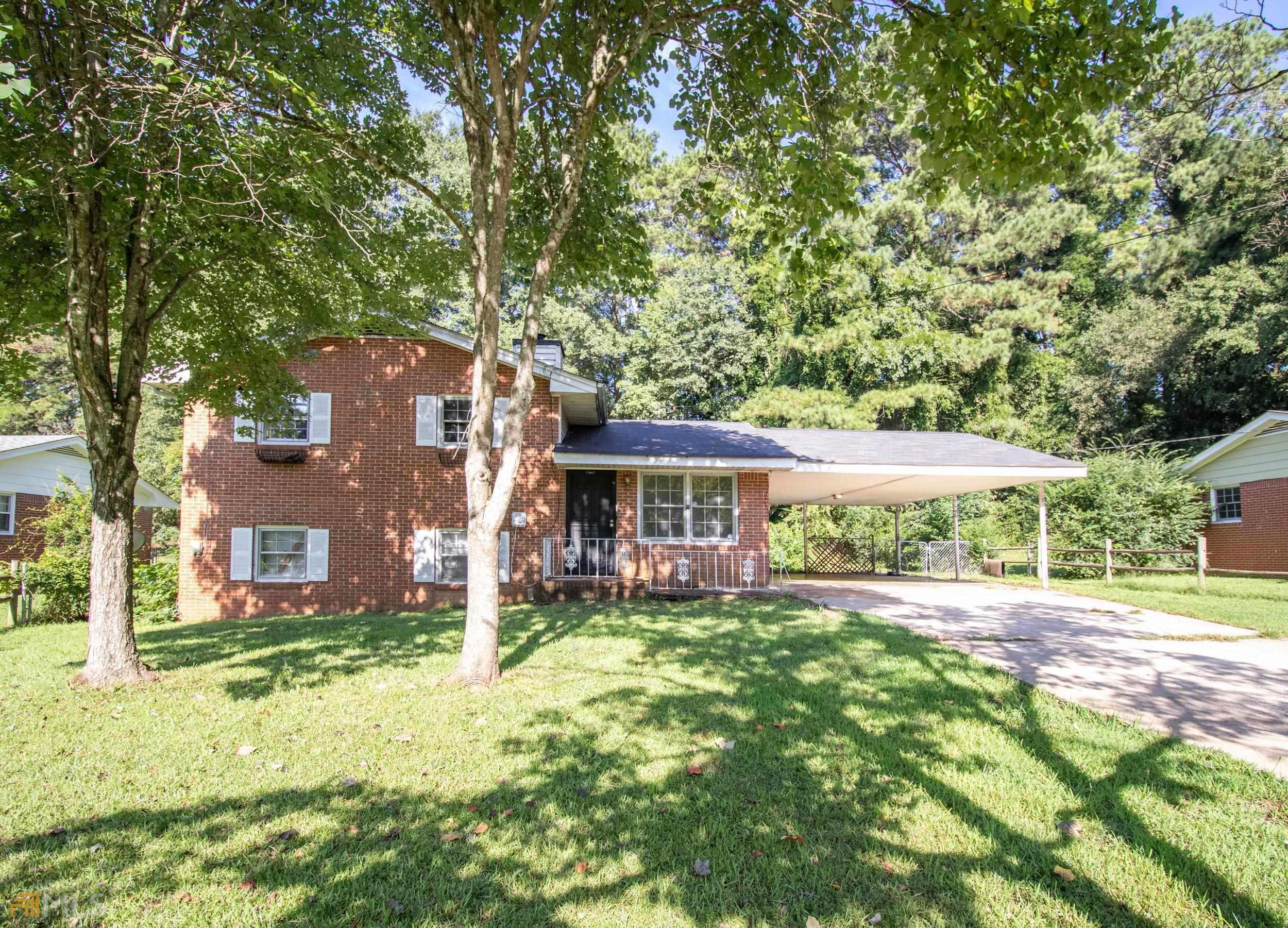 6473 Rabun Road Morrow, GA 30260 - Photo 1 of 1 front view of a house with a big yard