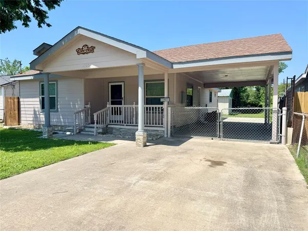 a view of a house with porch and furniture