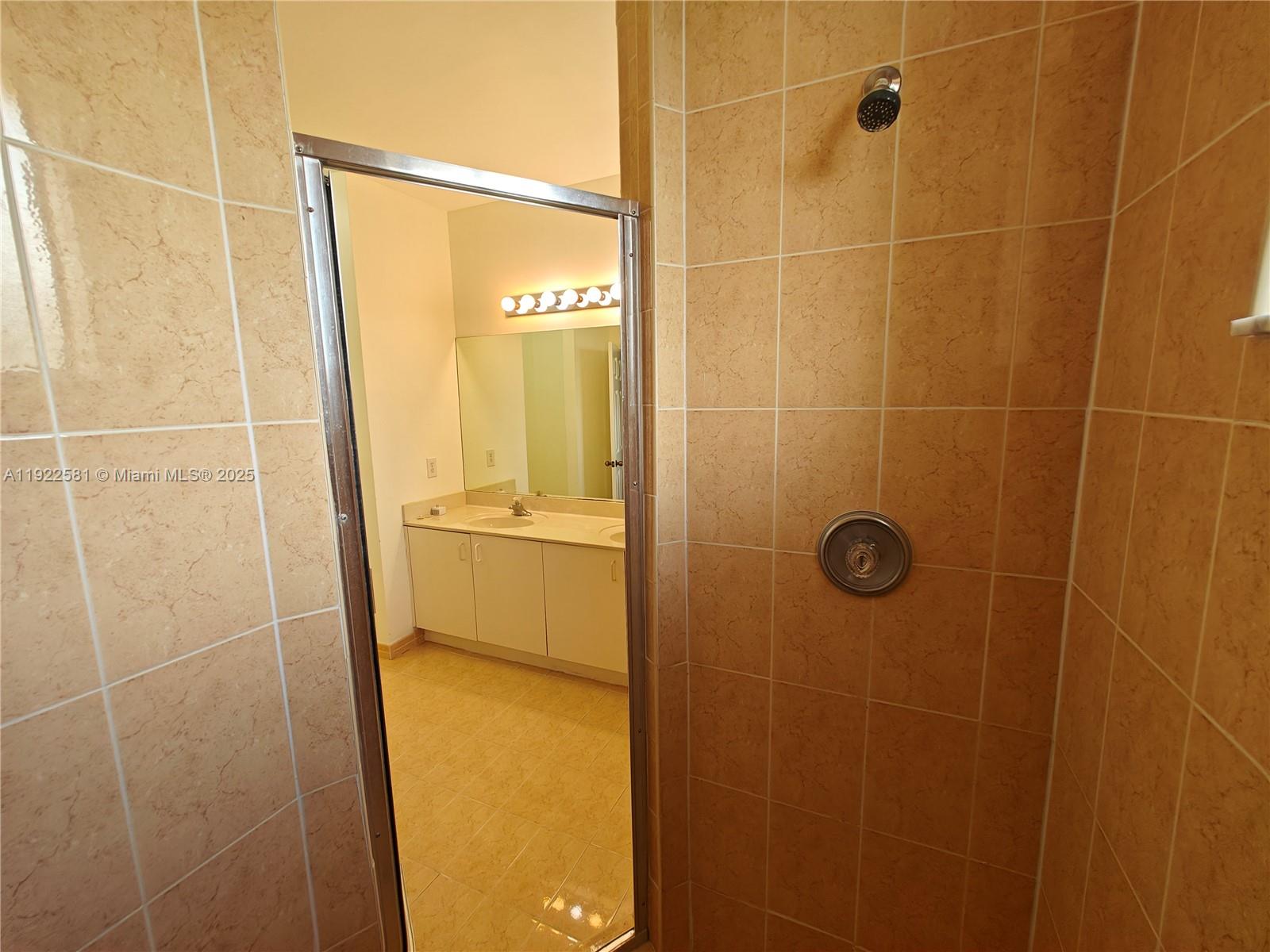 11252 Southwest 230th Terrace, Unit 11252 Miami, FL 33170 - Photo 15 of 28 a bathroom with a shower